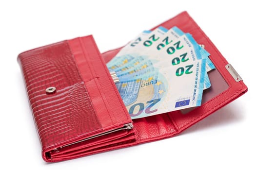 Opened Red Women Purse with 20 Euro Banknotes Inside - Isolated on White Background. A Wallet Full of Money Symbolizing Wealth, Success, Shopping and Social Status - Isolation