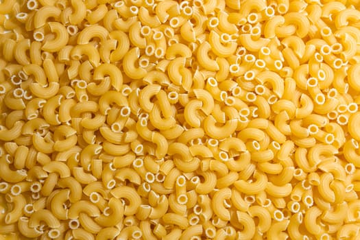 Uncooked Chifferi Rigati Pasta: A Culinary Canvas of Chifferi Rigati, Creating a Lively and Textured Background for Gourmet Cooking. Dry Pasta. Raw Macaroni - Top View, Flat Lay