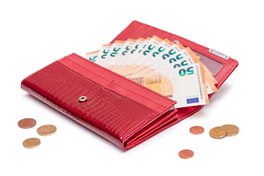 Opened Red Women Purse with 50 Euro Banknotes Inside and Scattered Euro Cent Coins - Isolated on White Background. A Wallet Full of Money Symbolizing Wealth, Success, Shopping and Social Status - Isolation