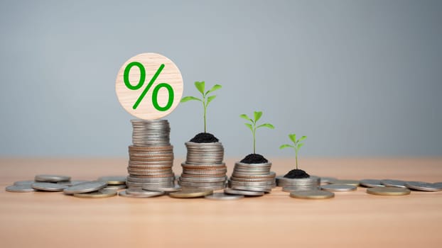 Concept of investment growth, Showing financial developments and business growth with a growing tree on a coin, Money Growth Concept, Concept of rich wealthy and saving money, Investing in stocks.