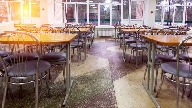 Cafeteria, dining room in a university, cafe with tables and chairs, counter bar hotel.