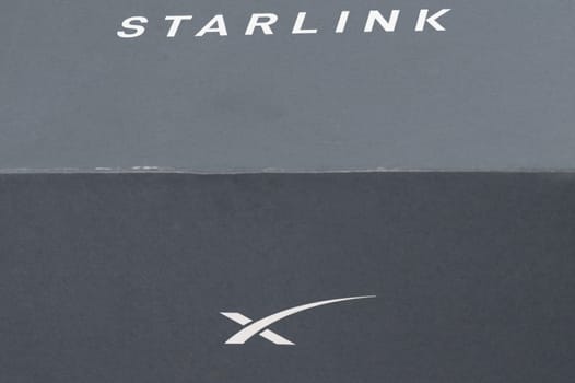 Ivano-Frankivsk, Ukraine December 2, 2023: Starlink antenna box with logo, Elon Musk space company.