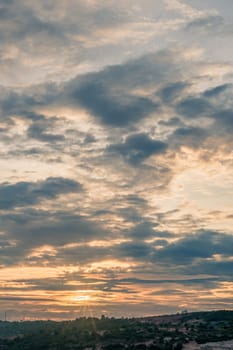 Abstract background sky Dawn Sunset Contrast dark shadow bright cloud sun orange silhouette above the mountains near the sea.