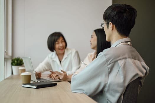 Professional business team brainstorming, discussing over new marketing at briefing.