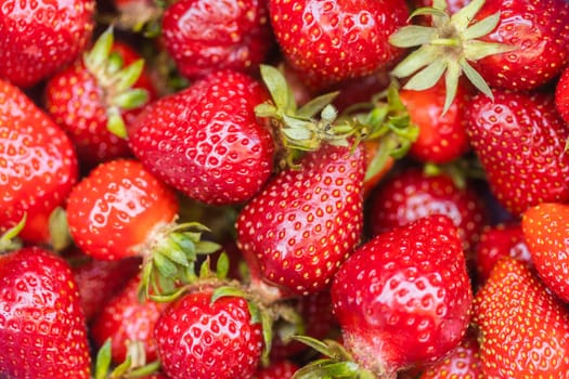 Background from freshly harvested strawberries, directly above. Copy space and mock up.