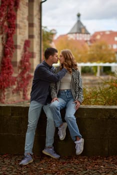 Young Cute Female Hugs Boyfriend. In Autumn Outdoor. Lovers Walking in Park. Attractive Funny Couple. Lovestory in Forest. Man and Woman. Cute Lovers in the Park. Family Concept. Happy Couple.