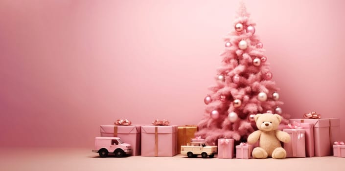 Christmas pink background with New Year tree and gift toys, Christmas gift box, fir tree and decorations on pink layout. Close-up with copy space.