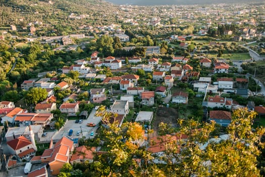 Mosque and panoramic cityscape of town Bar in Montenegro, aerial view.