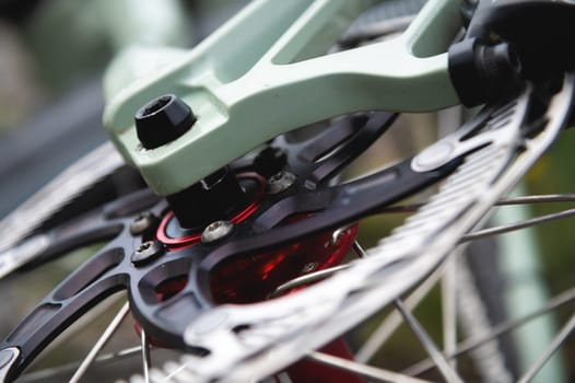 disc brakes on a bicycle wheel close-up. mountain bike detail close up.