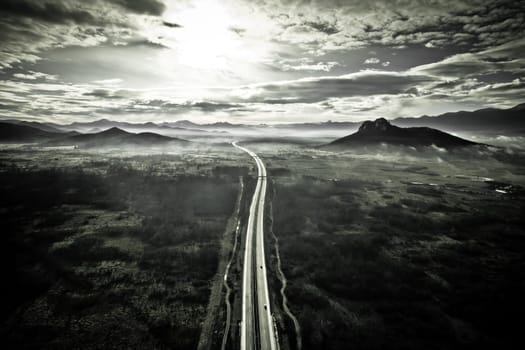 Lika region. A1 highway and Zir hill near Velebit mountain in Lika landscape aerial black and white view. Rural Croatia