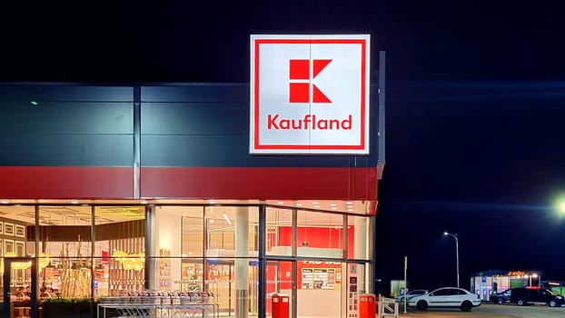 HUSTOPECE, CZECH REPUBLIC - DECEMBER 14, 2023: Kaufland logo on hypermarket from German chain, part of Schwartz Gruppe which also owns Lidl. It operates over 1,500 stores in Germany, Croatia, the Czech Republic, Slovakia, Poland, Romania, Bulgaria and Moldova.