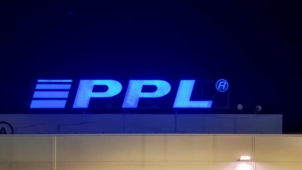 HUSTOPECE, CZECH REPUBLIC - DECEMBER 14, 2023: PPL logo on the depot building. PPL CZ specializes in parcel transport not only in the Czech Republic, but also throughout Europe. It employs over 1000 staff and 2,000 drivers who deliver tens of millions of shipments every year.