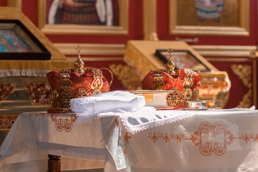2 crowns prepared for a wedding ceremony in a Christian Orthodox church.