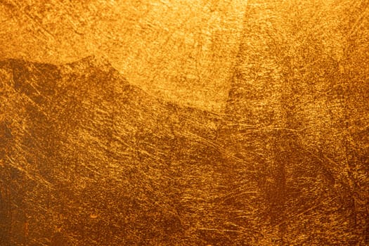 Gold background with scratched texture.