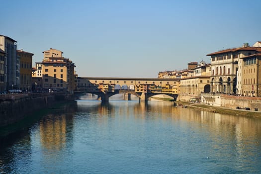 Florence, Italy - 12.02.2023: View of the famous Ponte alle Grazie bridge and the Arno river in Florence. High quality photo