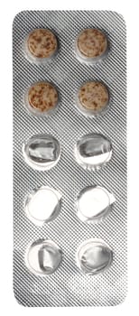 Round brown tablets in blister pack, top view