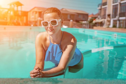 Bikini-clad woman enjoys poolside relaxation. Poolside ambiance. Capturing woman's relaxed time near pool