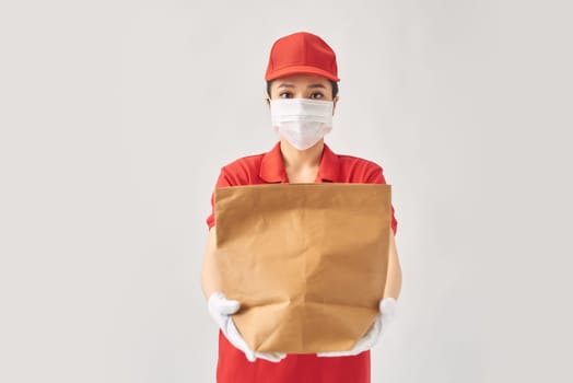 delivery employee woman hold kraft paper takeaway bag mockup isolated on white background