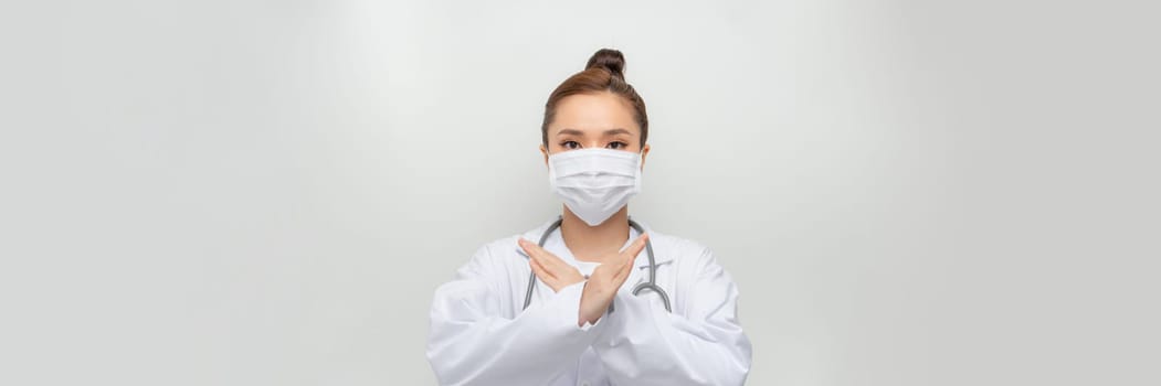 woman doctor show stop gesture on the white background