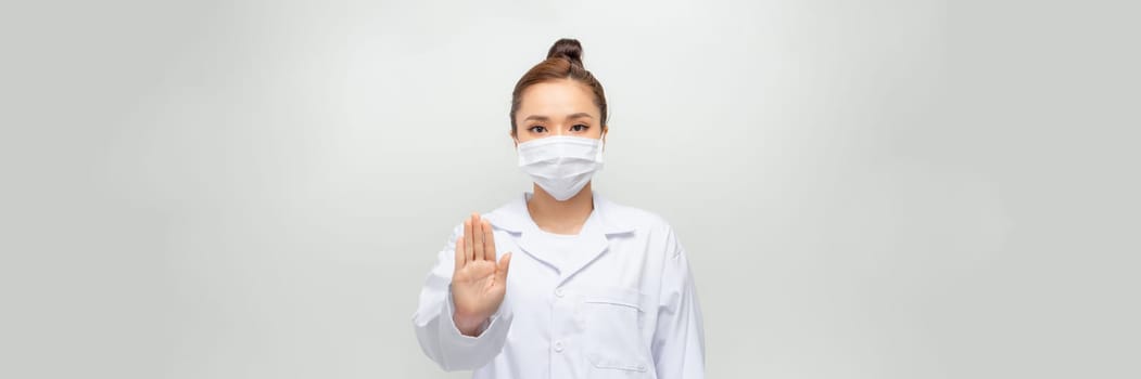 woman doctor show stop gesture on the white background