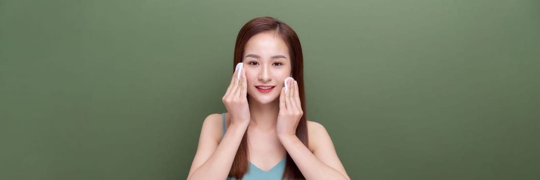 young woman cares for face skin on banner backround