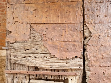 The wooden medieval door of noli medieval village liguria italy