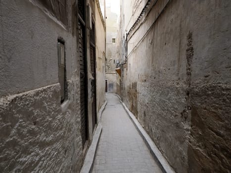 A Small street in Fez Fes medieval medina (old town). Morocco.