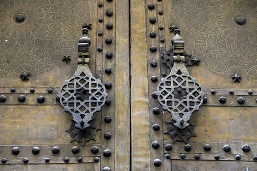 old wooden doot in Fez Fes Blue and white medina (old town). Morocco.