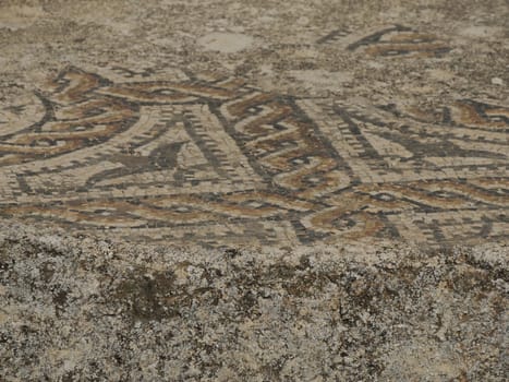 Mosaic of Volubilis Roman ruins in Morocco- Best-preserved Roman ruins located between the Imperial Cities of Fez and Meknes on a fertile plain surrounded by wheat fields.