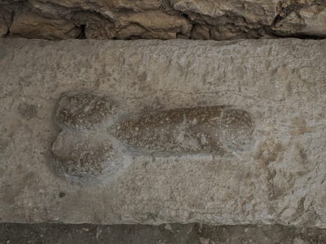 brothel penis sign at Volubilis Roman ruins in Morocco- Best-preserved Roman ruins located between the Imperial Cities of Fez and Meknes on a fertile plain