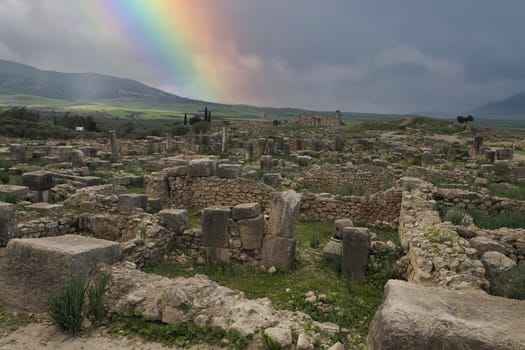 Volubilis Roman ruins in Morocco- Best-preserved Roman ruins located between the Imperial Cities of Fez and Meknes on a fertile plain surrounded by wheat fields.