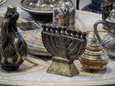 jewish Craftsman painting and decorating ceramic products in pottery factory in Fez, Morocco, North Africa