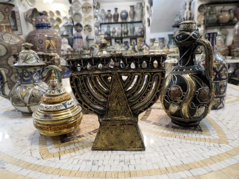 jewish Craftsman painting and decorating ceramic products in pottery factory in Fez, Morocco, North Africa