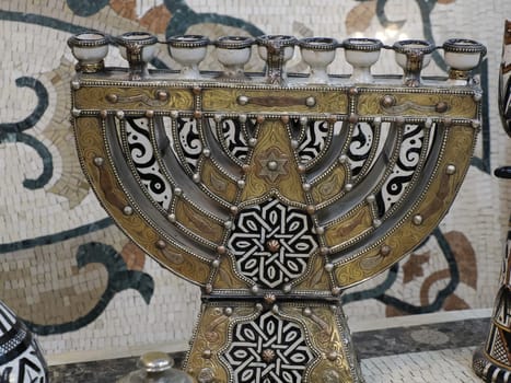 jewish Craftsman painting and decorating ceramic products in pottery factory in Fez, Morocco, North Africa