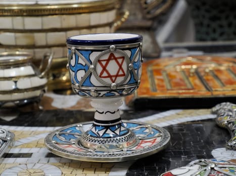 jewish Craftsman painting and decorating ceramic products in pottery factory in Fez, Morocco, North Africa