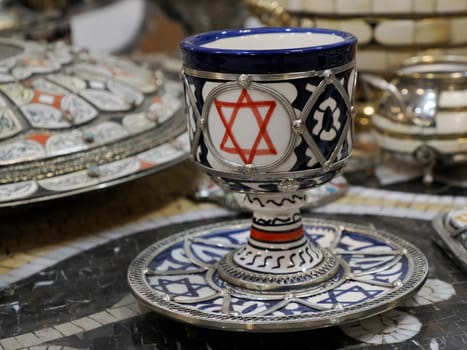 jewish Craftsman painting and decorating ceramic products in pottery factory in Fez, Morocco, North Africa