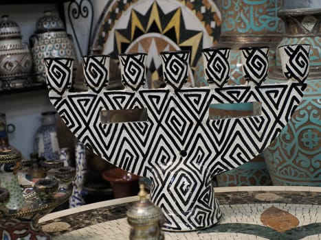 jewish Craftsman painting and decorating ceramic products in pottery factory in Fez, Morocco, North Africa