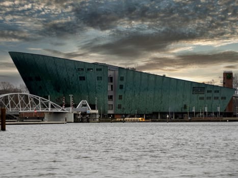 naval museum amsterdam old houses view from canals at sunset