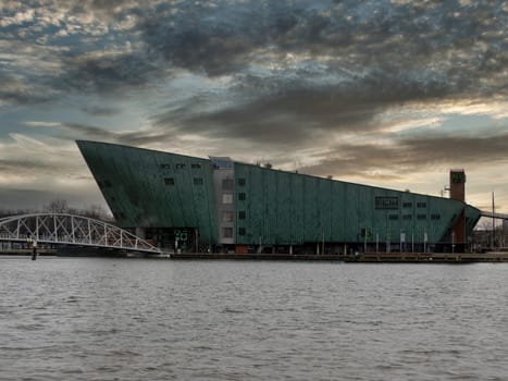 naval museum amsterdam old houses view from canals at sunset