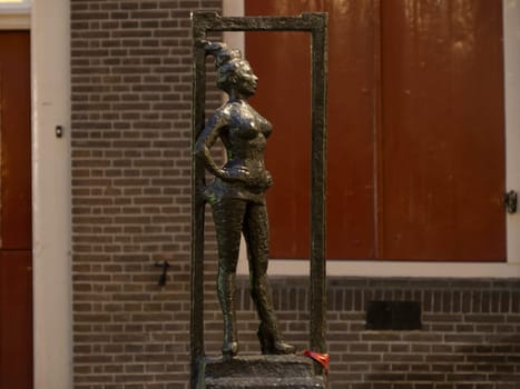 Bella amsterdam prostitute sculpture red light district at night