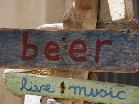 A beer live music wood sign detail close up