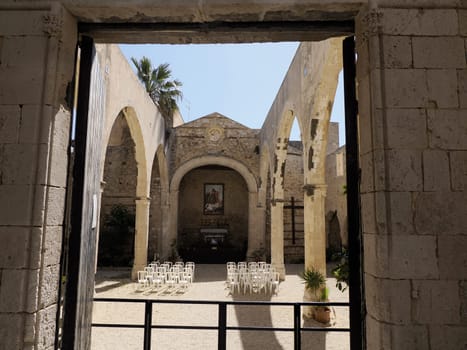 roof less church San Giovanni Battista San Giovannello Giudecca district ortigia syracuse old buildings street view on sunny day Sicily, Italy