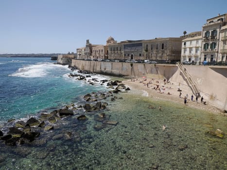 sea on ortigia syracuse old buildings street view on sunny day Sicily, Italy