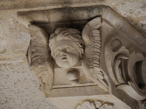 balcony sculpture ortigia syracuse old buildings street view on sunny day Sicily, Italy