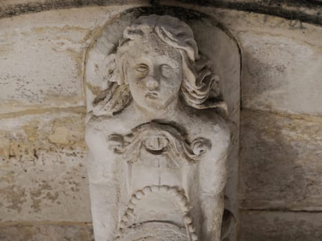 balcony sculpture ortigia syracuse old buildings street view on sunny day Sicily, Italy