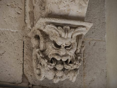 balcony sculpture ortigia syracuse old buildings street view on sunny day Sicily, Italy