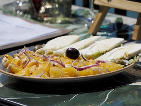 orange fennel and olives plate at street food in Siracuse in sicily, Italy