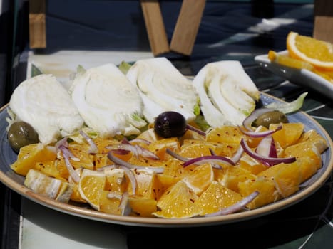 orange fennel and olives plate at street food in Siracuse in sicily, Italy