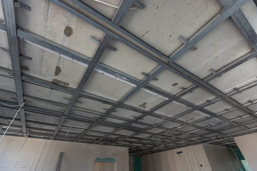 structure of ceiling suspension, installation of gypsum plasterboard and light. High quality photo