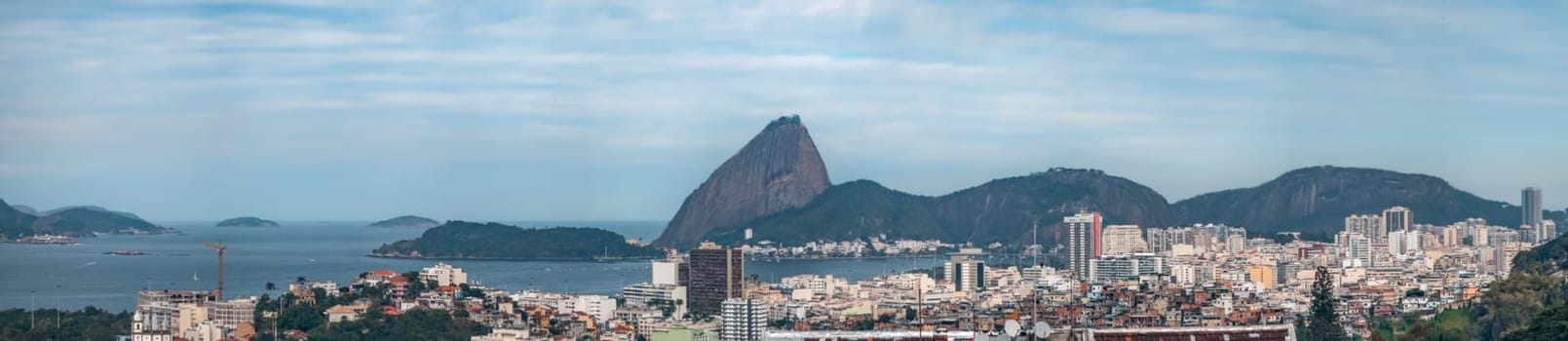 Vibrant Brazilian cityscape merging urban living with natural hills and ocean scenery.